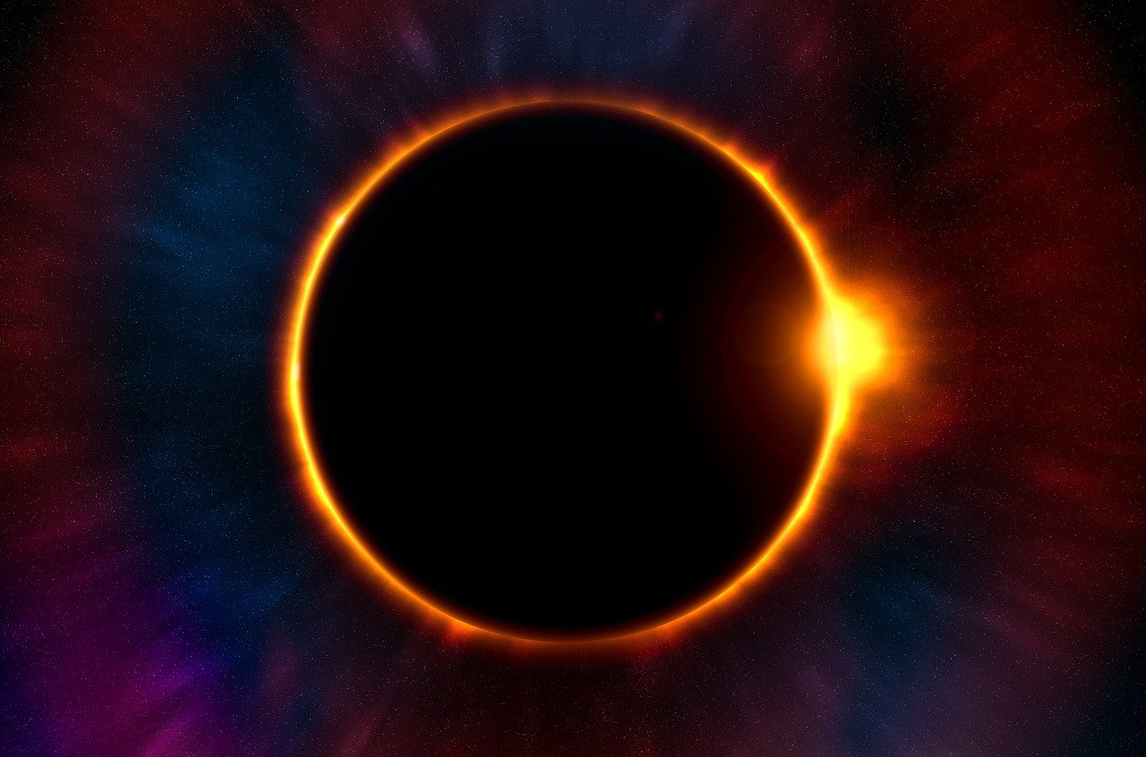 Black background with a solar eclipse in the middle