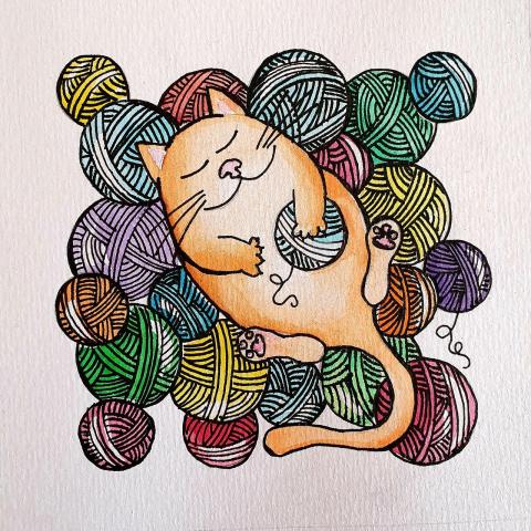 A cartoon cat in pile of yarn balls