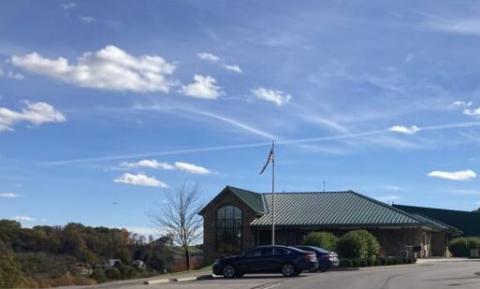 Blue sky with Pine Community Center at the bottom