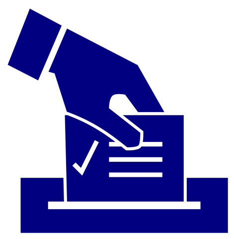 Hand putting their vote in a ballot box